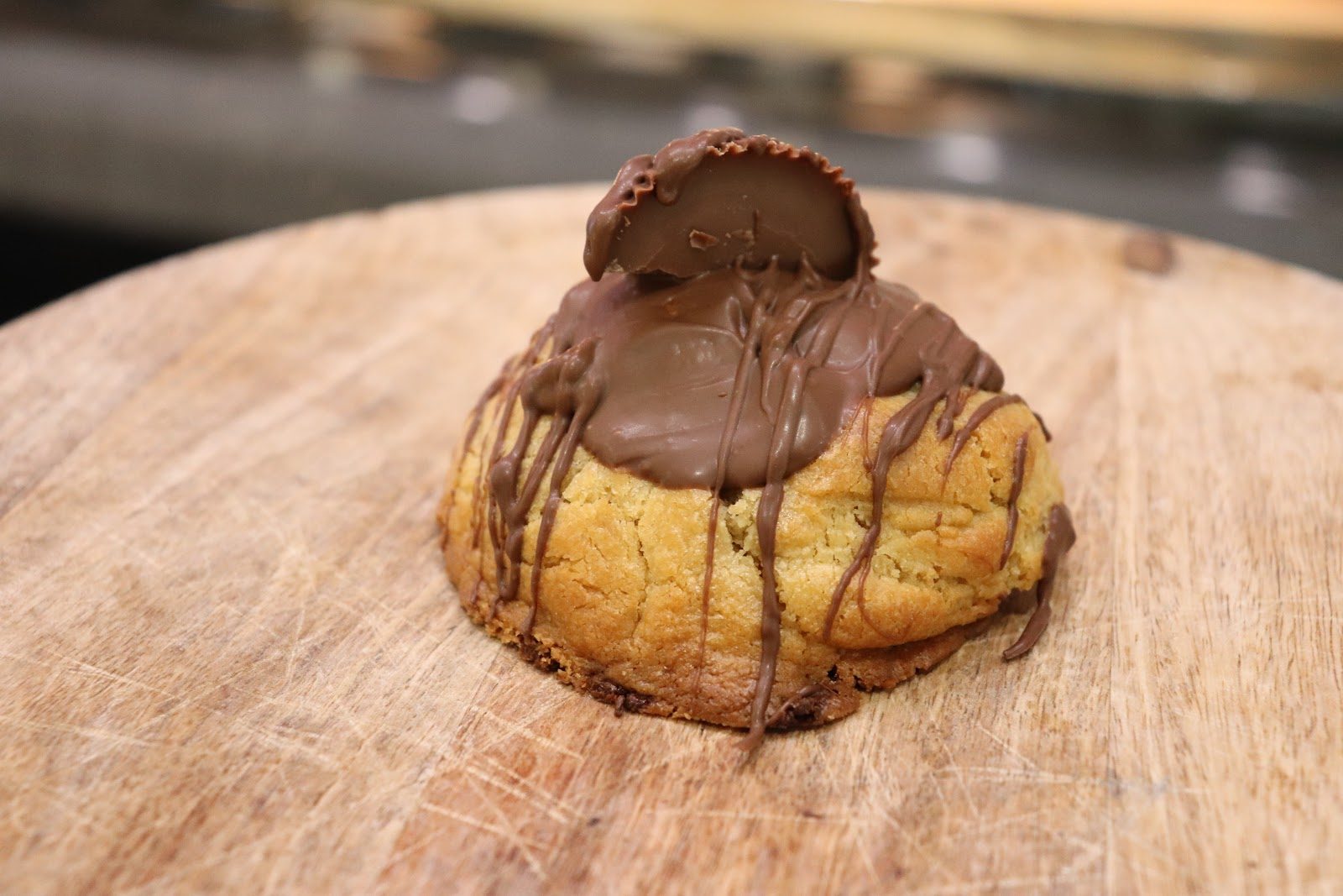 Reese’s-topped cookie on a kitchen board at Dough Bros