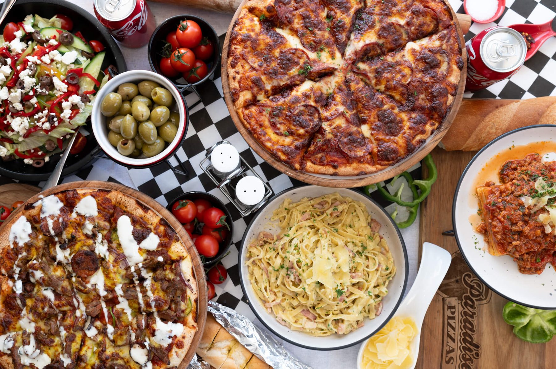 Paradise Pizzas table — carbonara, lasagna and pies